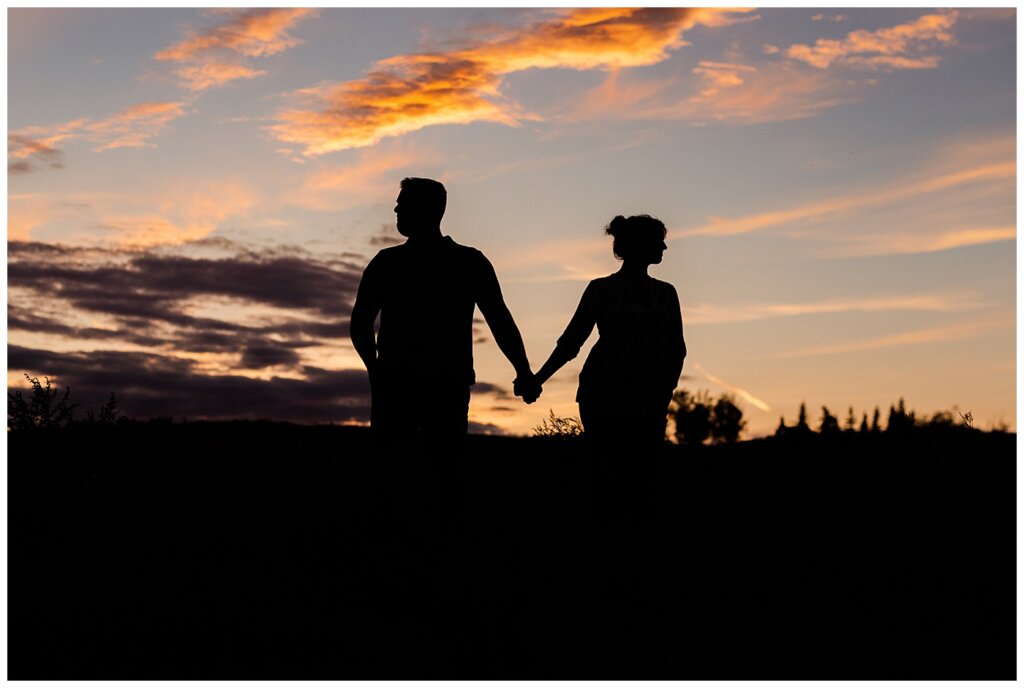 Mitch & Val - Engagement Session in Wascana Habitat Conservation Area - 15 - Silhouette of Couple at Douglas Park Hill