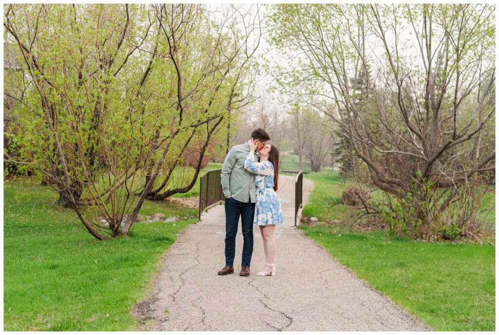 Charlie & Brittany Engagement - Regina engagement - 07 - Couple kiss in the park