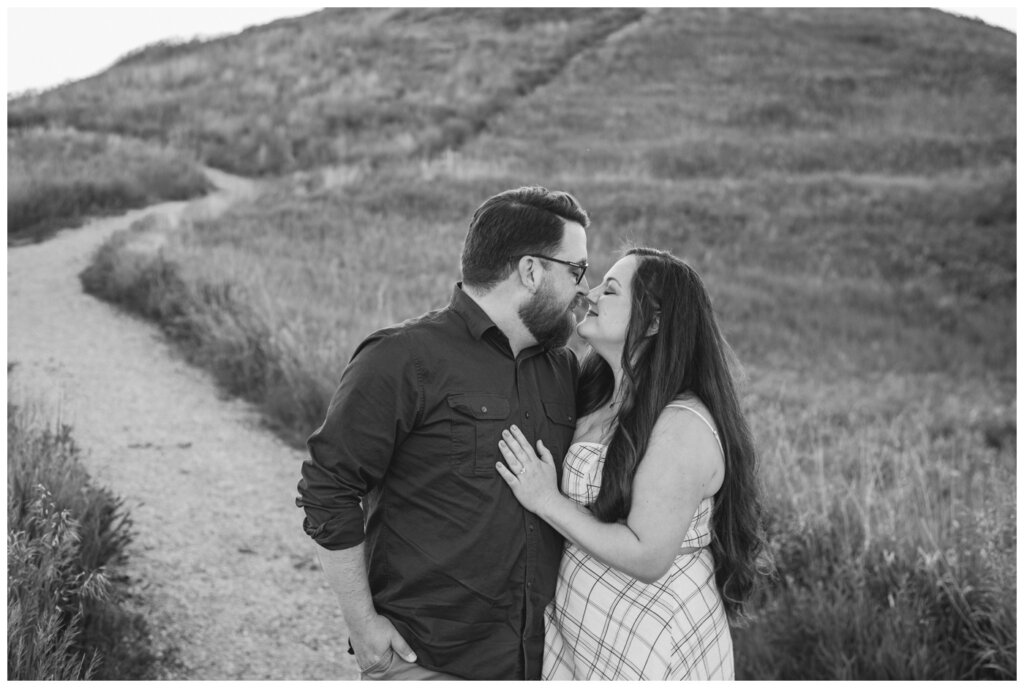 Dustin & Kristyn - Wascana Trails Engagement - 02 - Couple nuzzle noses together