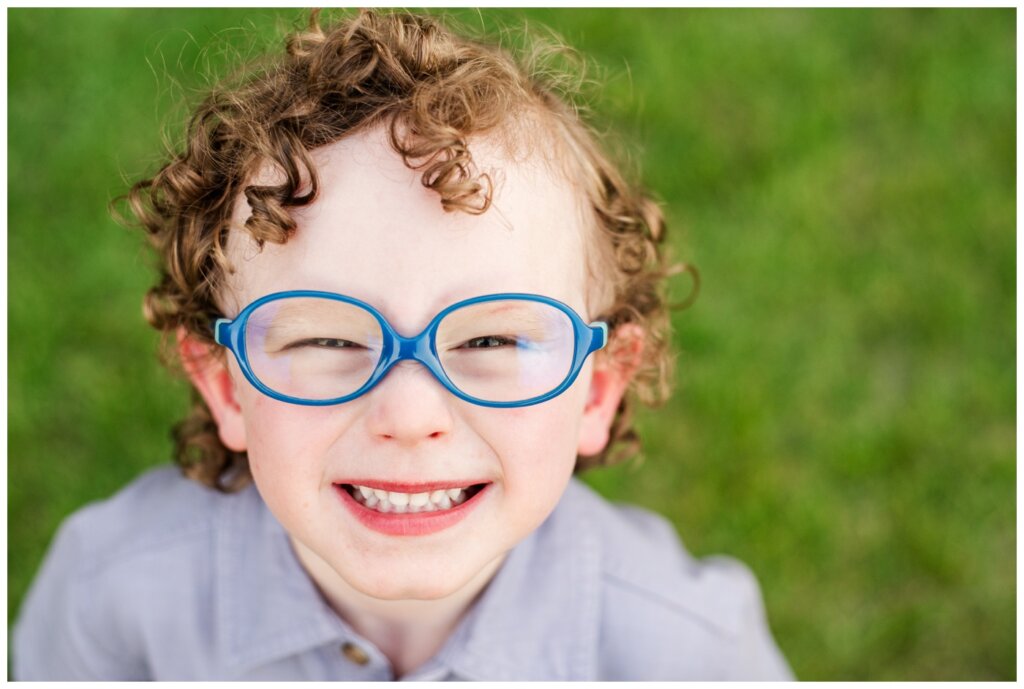 Piluk Family - TC Douglas Building - 09- Little boy with curly hair and glasses