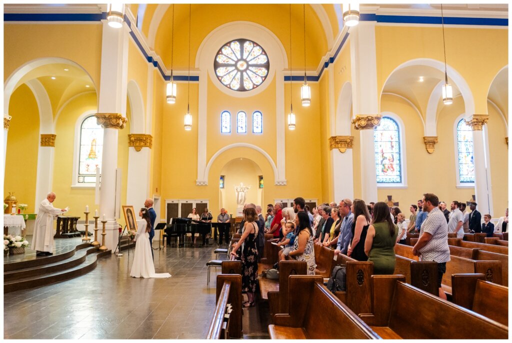 Remi & Celine - Regina Wedding - Holy Rosary Cathedral - 04- Family surround couple at mass