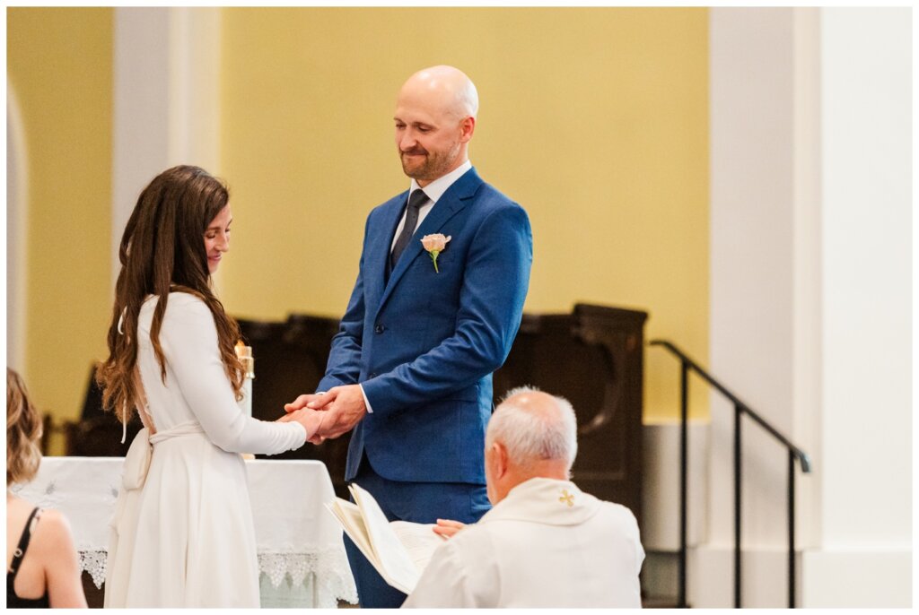 Remi & Celine - Regina Wedding - Holy Rosary Cathedral - 05- Couple exchange rings