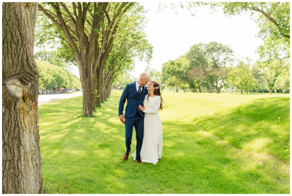 Remi & Celine - Regina Wedding - Les Sherman Park- 14- Bride is enamoured with her Groom