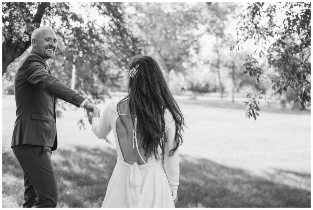 Remi & Celine - Regina Wedding - Les Sherman Park- 18- Groom twirls the bride