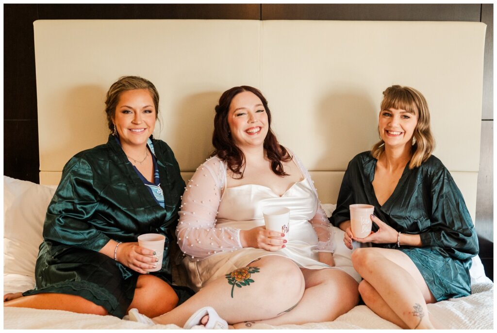 Darren & Amber - Regina Wedding - Summer Wedding 2024 - 05 - The Atlas Hotel - Bride & bridesmaids with mimosas