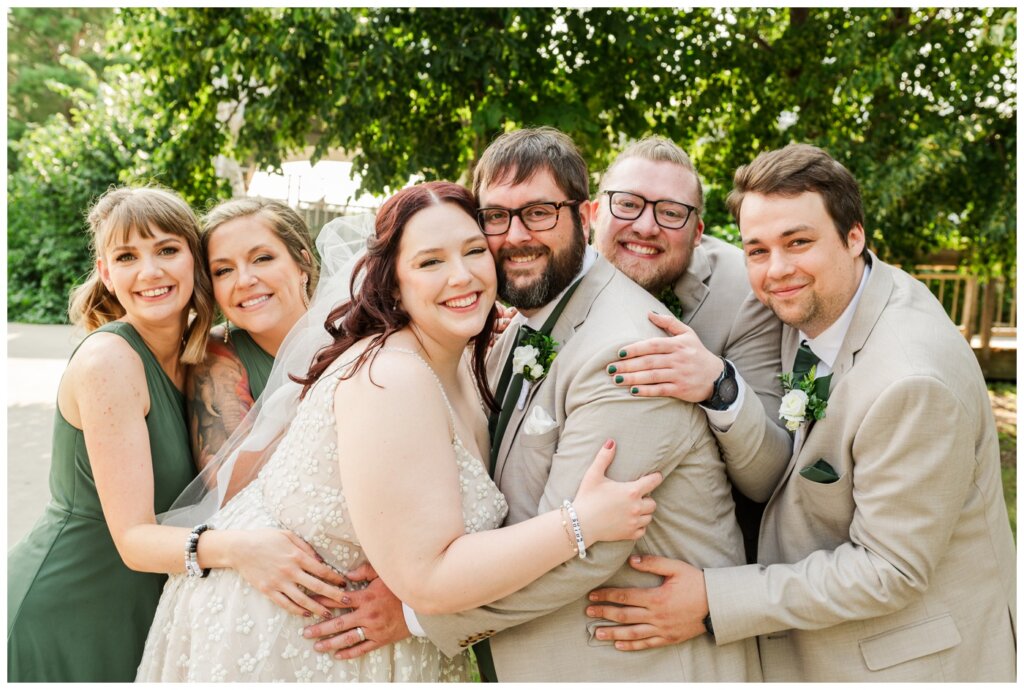 Darren & Amber - Regina Wedding - Summer Wedding 2024 - 21 - Wascana Park - Bridal party hugs together