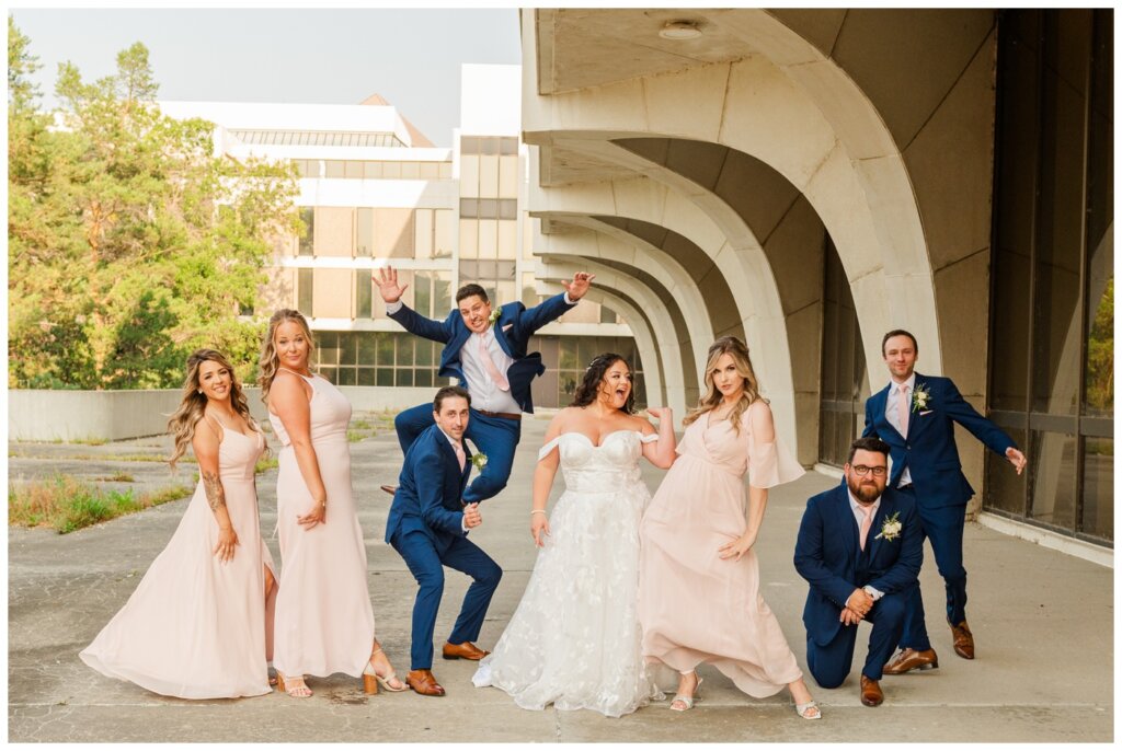 Dustin & Kristyn - Regina Wedding - 22 - University of Regina - Bridal party strikes a pose