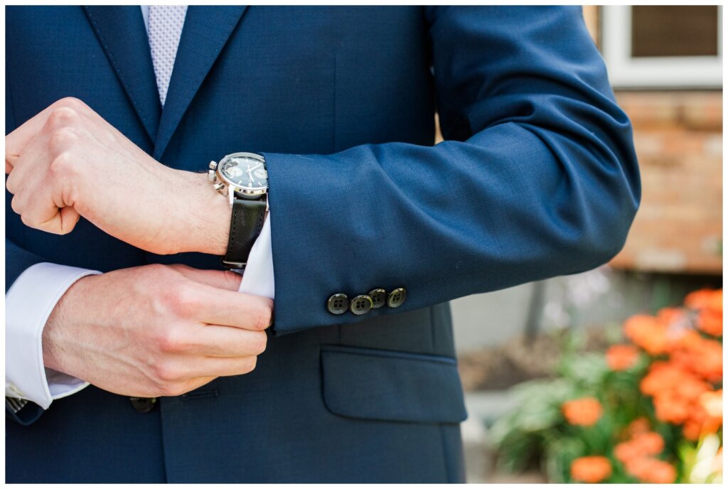 Evan & Melissa - Regina Wedding - Summer 2024 Wedding - 02 - Groom puts on his new Hunter watch