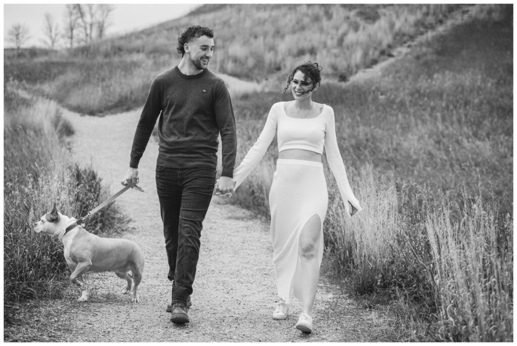 Blayde & Hanna - Regina Engagement Session - 01 - Wascana Trails - Couple walks their dog