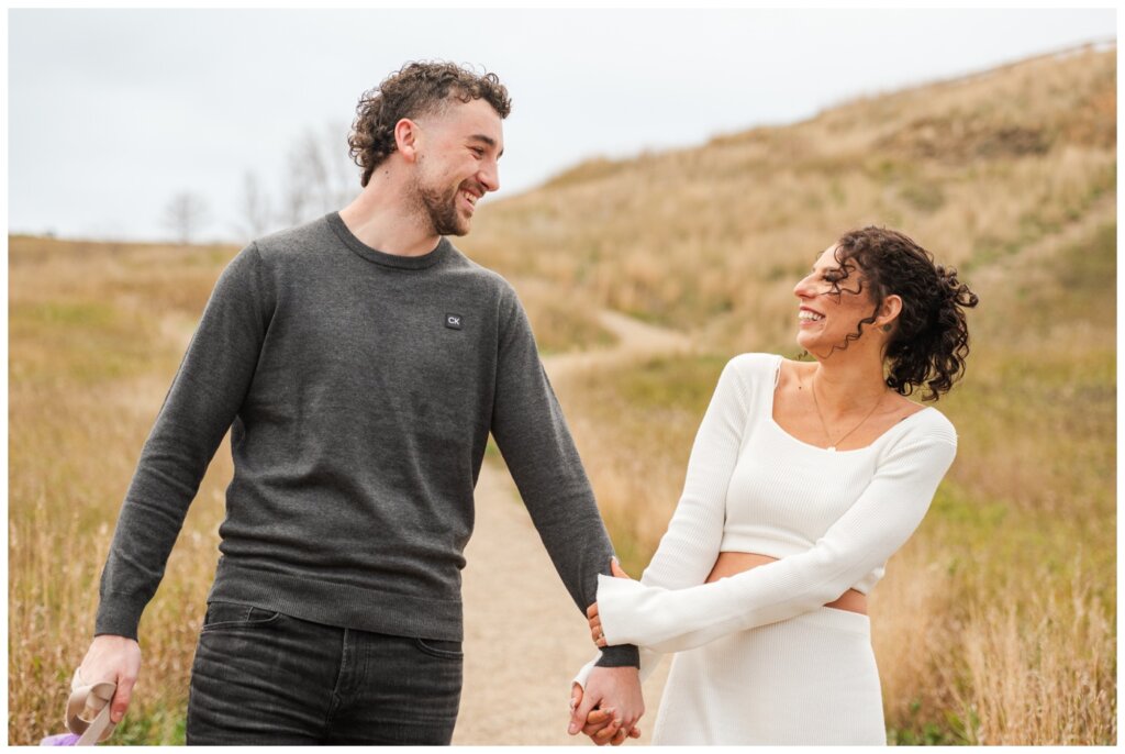 Blayde & Hanna - Regina Engagement Session - 02 - Wascana Trails - Couple walks together