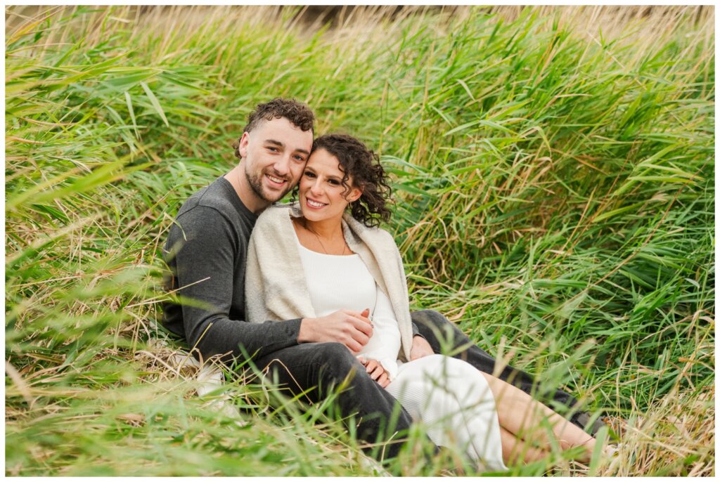 Blayde & Hanna - Regina Engagement Session - 07 - Wascana Trails - Couple smiles at the camera