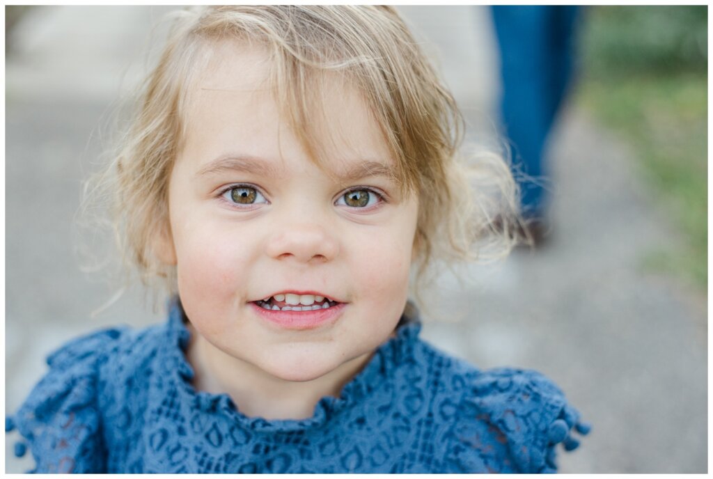 Filby Family 2024 - Regina Family Photography - 02 - Wascana View Park - Close up of little girl in blue lace dress