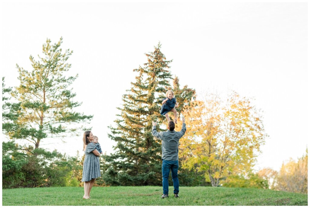 Filby Family 2024 - Regina Family Photography - 07 - Wascana View Park - Dad throws daughter in the air