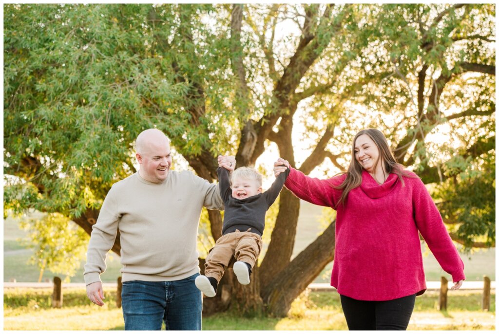 Munroe Family 2024 - Wascana Habitat Conservation Area -05 - Toddler swings in the air