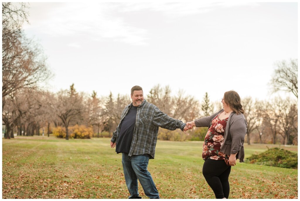 Scott & Ashley - Regina Family Photography - Provincial Archives - 07 - Husband leads wife as they walk