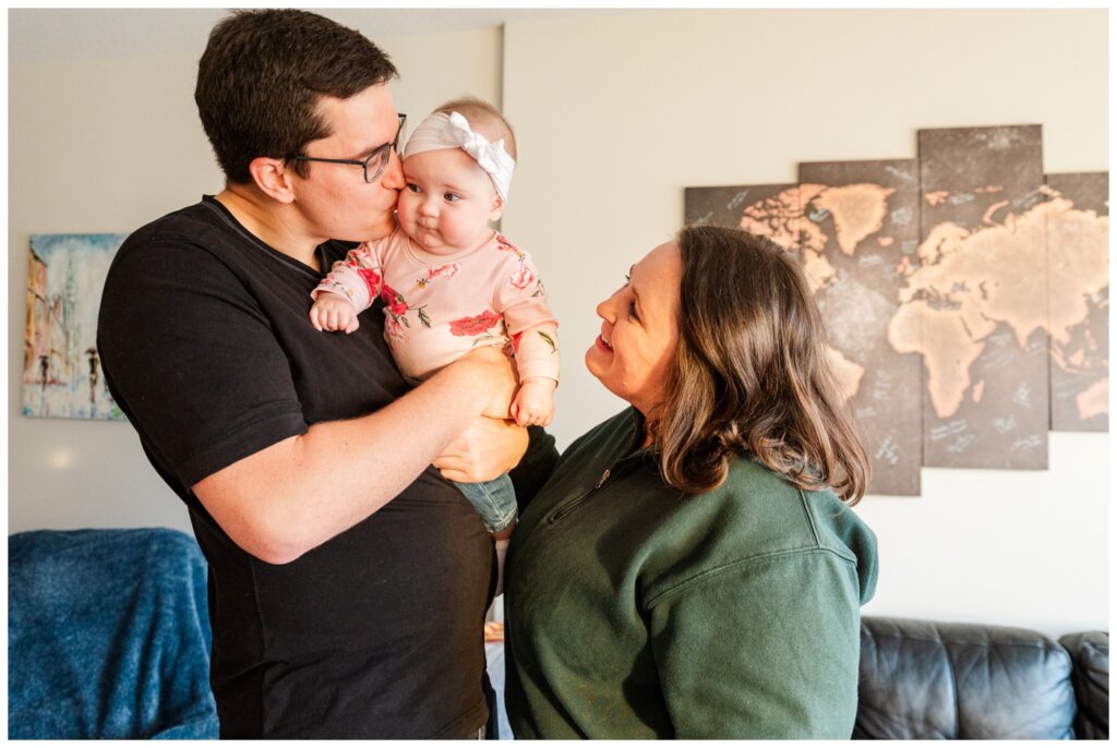 Ben & Megan - In home family session - Regina Family Photography - 04 - Mom & Dad smile at baby