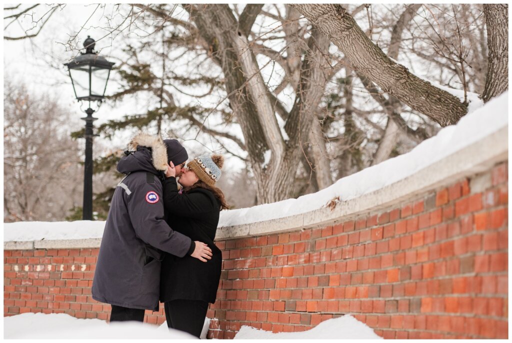 Sheldon & Amy - Regina Winter Photography - Wascana Park - 04 - Couple shares a kiss at Speakers Corner