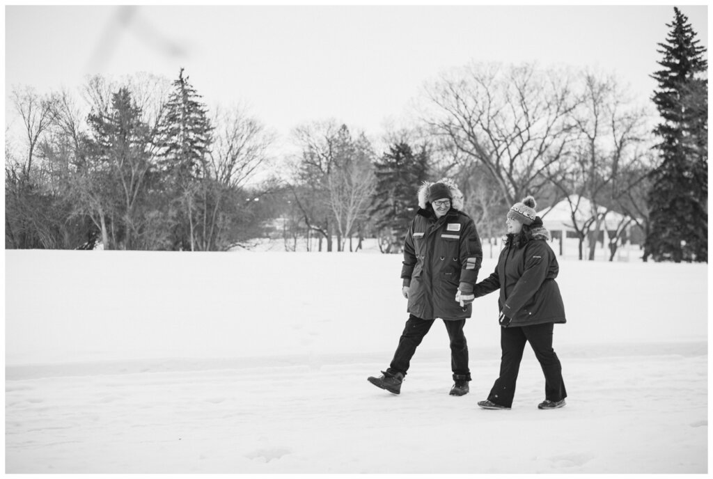 Sheldon & Amy - Regina Winter Photography - Wascana Park - 06 - Couple walks through the park in winter