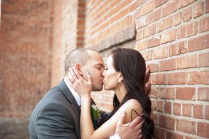Regina Wedding Photographer - Andrew & Alicia - Brick Wall Kiss