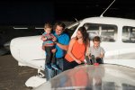 Favel Family on a plane at the Regina Flying Club - Favel Family 2015