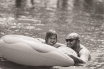 Donut floating with dad in the pool