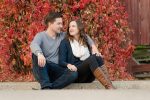 Couple in front of red leaves