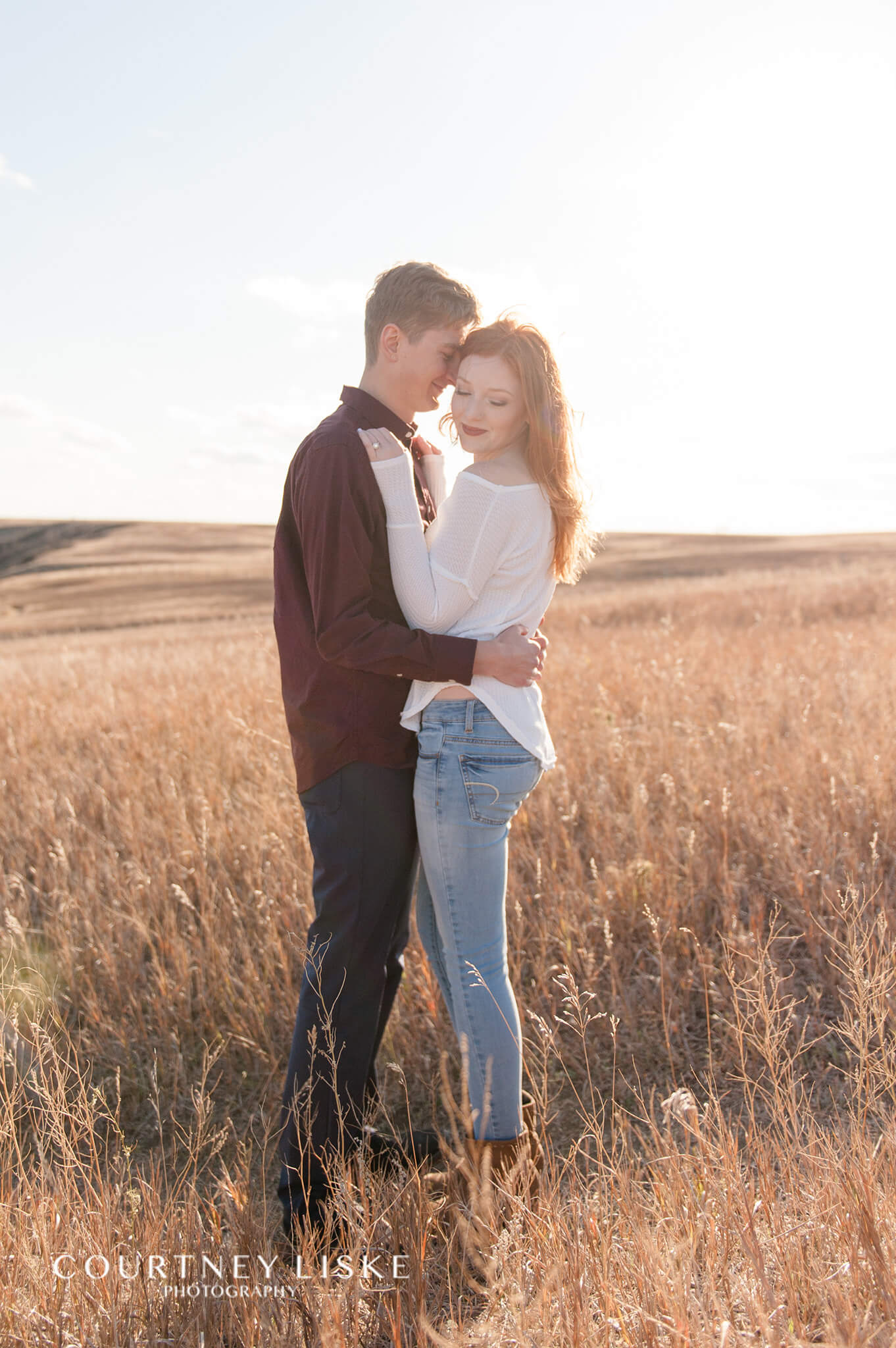 Couple in the field at Wascana Trails
