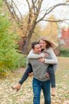 Couple laughs together as they walk through Wascana Park