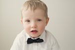 Little boy with white shirt and polka dot bowtie