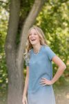 Teenage girl in chambray dress in the park