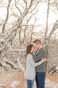Man and woman stand together in the snow