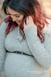 Pregnant woman with black and red ombre hair