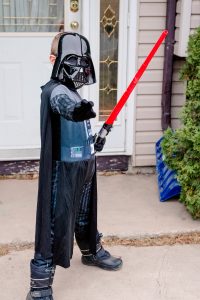 Boy dressed as Darth Vader for Halloween