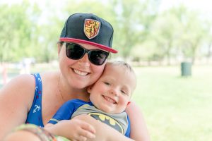 Woman in Gryffindor hat with son in Warman