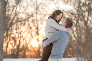 Cory lifting Kelsey in Regina engagement session