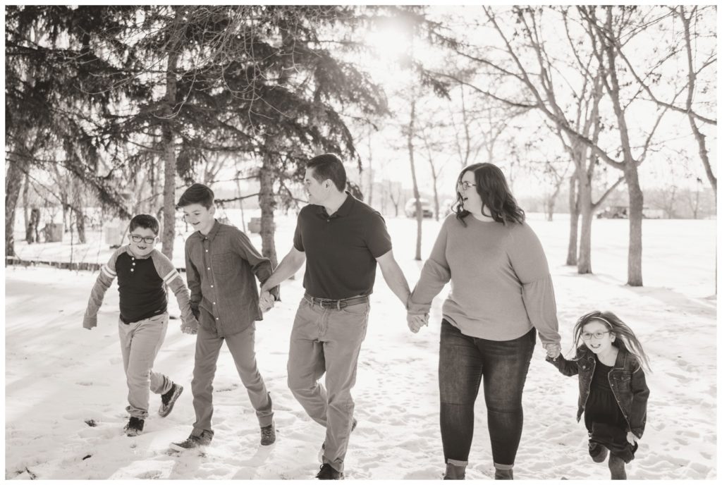 Regina Family Photographer - Goudy Family - Winter Family Session - Snow - Family of Five - Walking Holding Hands - Candy Cane Park