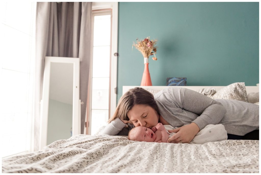 Regina Family Photographer - Jensen Newborn - Keltie-Jensen - In home Family Session - Teal Bedroom Wall - Kisses for baby