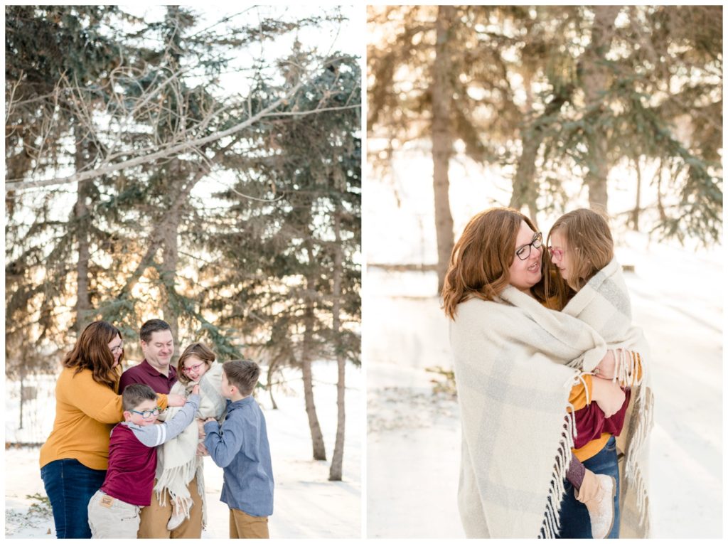 Regina Family Photography- Goudy Family - Winter Family Session - Snow - Candy Cane Park - Mother holding daughter in grey knit blanket