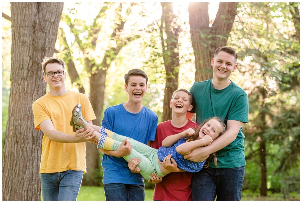 Regina Family Photographer - Butler Family - Caris - Lucas - Aaron - Josiah - Nathan - Wascana Park - Four Brothers carrying Younger Sister