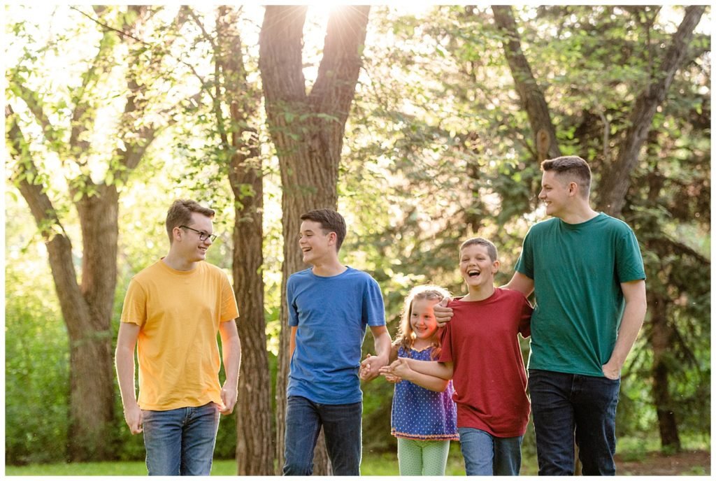 Regina Family Photographers - Butler Family - Caris - Lucas - Aaron - Josiah - Nathan - Wascana Park - Four Brothers walking with Younger Sister