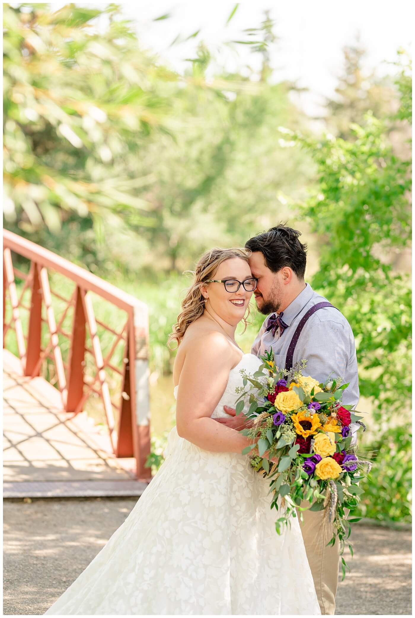 Regina Wedding Photographer - Ryan - Aeliesha - Bride & groom in front of the bridge of AE Wilson Park