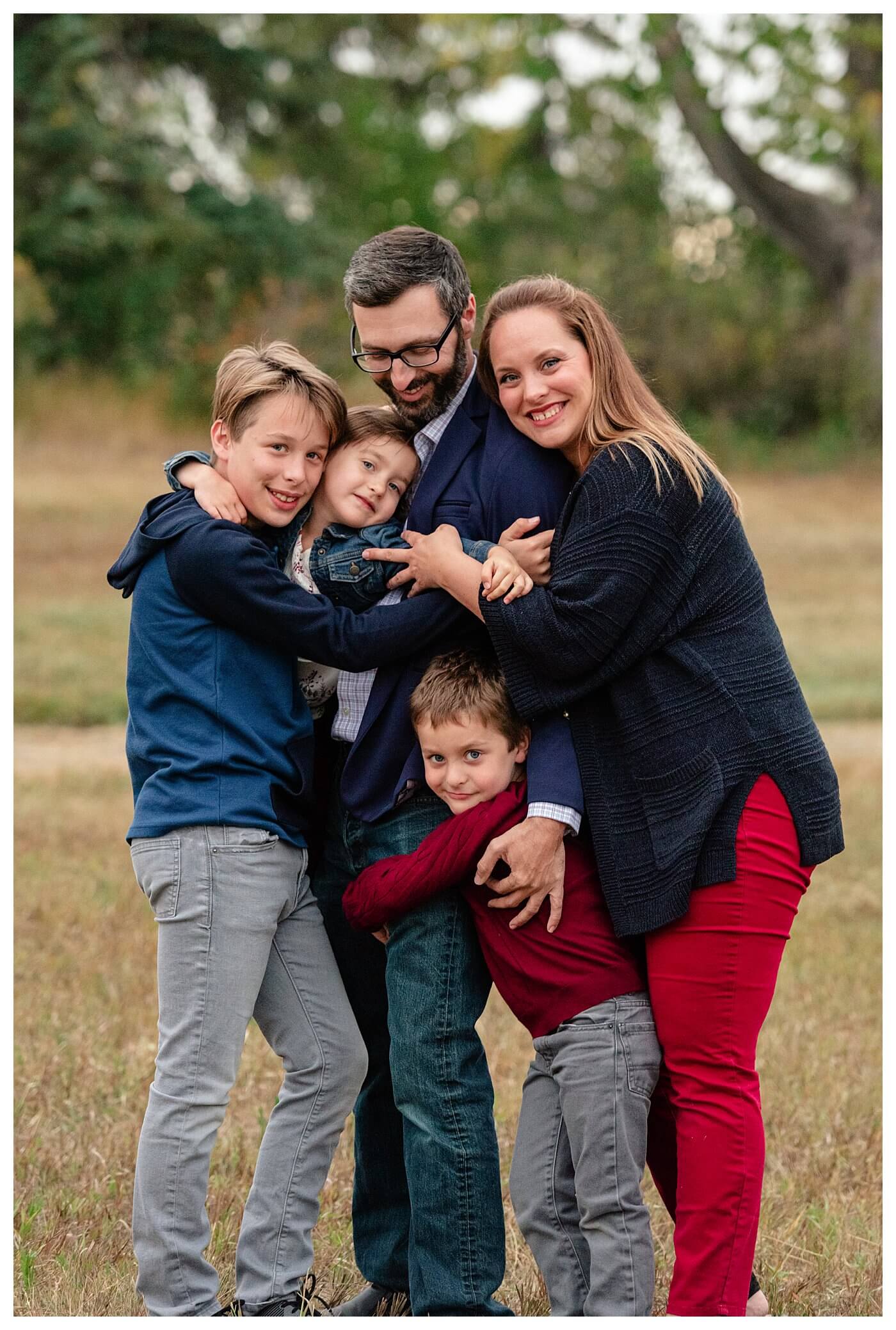 Schlamp Family 2020 - 010 - Regina Family Photographer - Family hugging