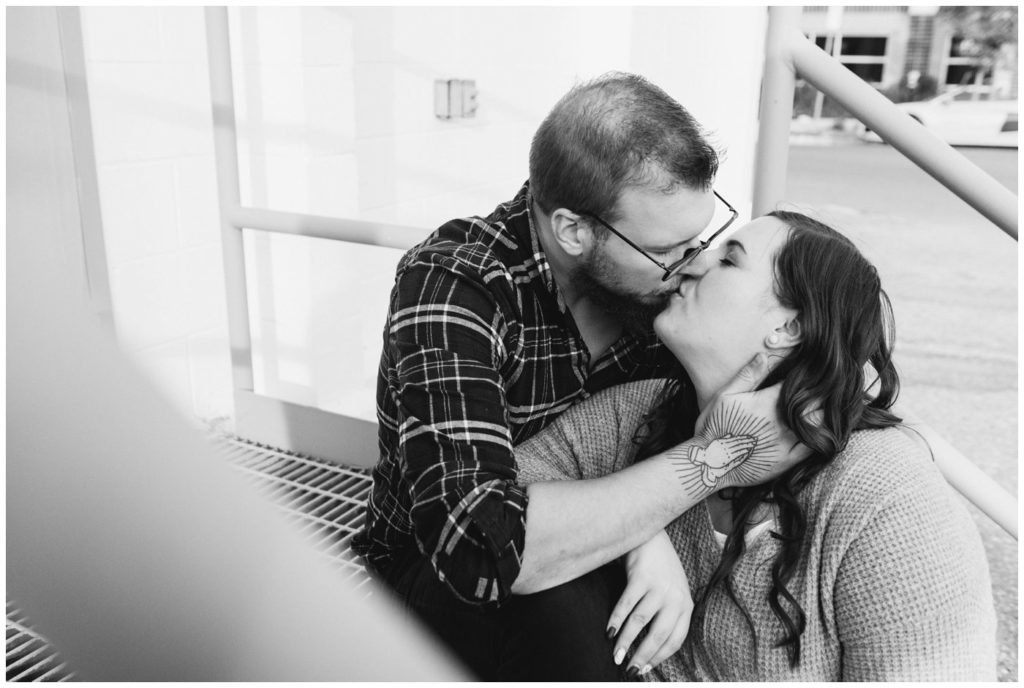 Regina-Engagement-Photographer-Kolton-Maxine-002-Couple-kissing-on-steps