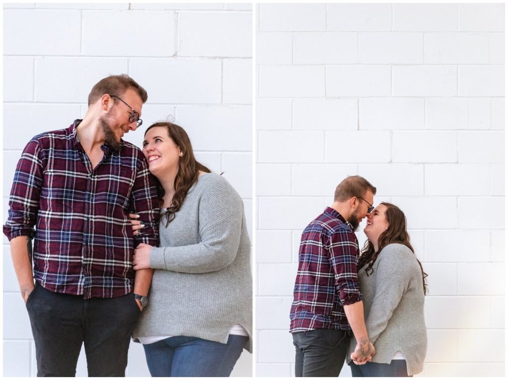 Regina-Engagement-Photographer-Kolton-Maxine-004-kissing-on-rose-street.jpg