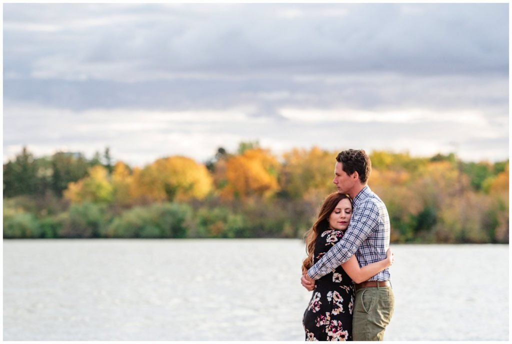 Regina-Engagement-Photography-007-Tim-Jennelle-Standing-on-the-docks-on-Wascana-lake