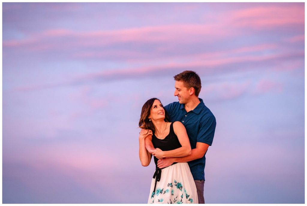 Regina-Engagement-Photography-Taylor-Jolene-010-White-City-Engagement-Session-Couple-in-front-of-beautiful-purple-sunset-sky