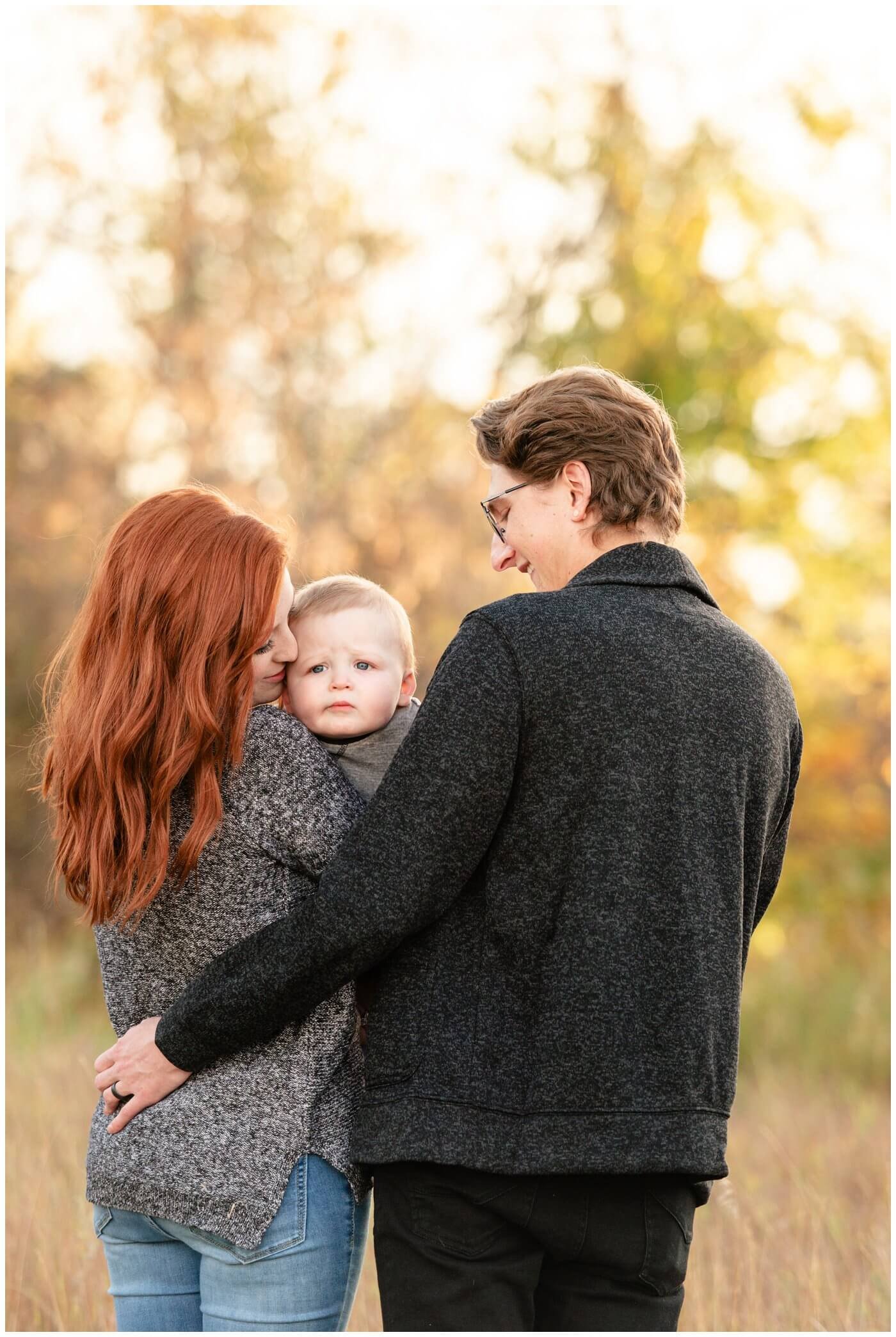 Regina-Family-Photography-McFie-family-006-Child-not-interested-in-photos-