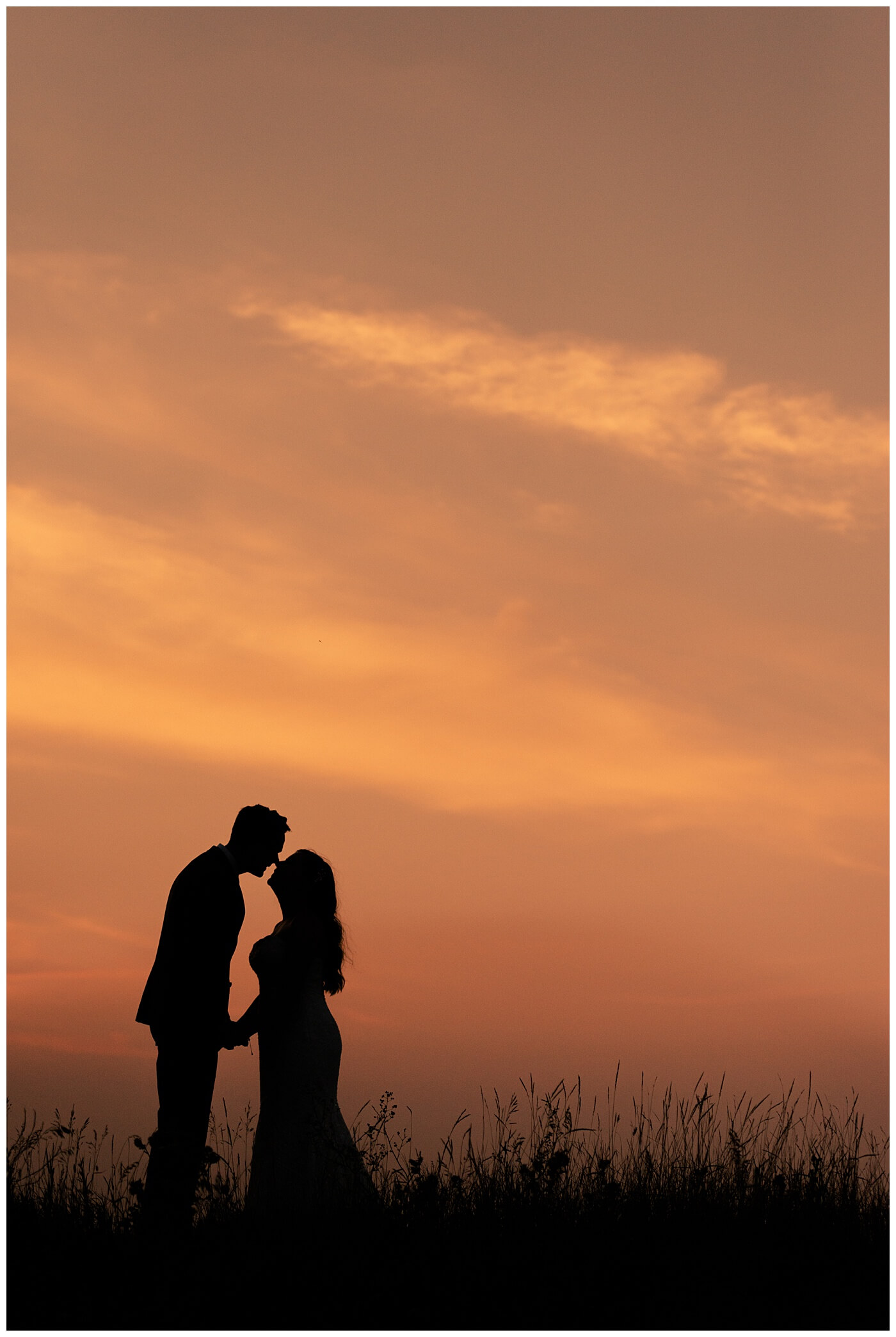 Regina Wedding Photographer - Tim & Jennelle At Home Wedding - Sunset Photo silhouette of bride and groom
