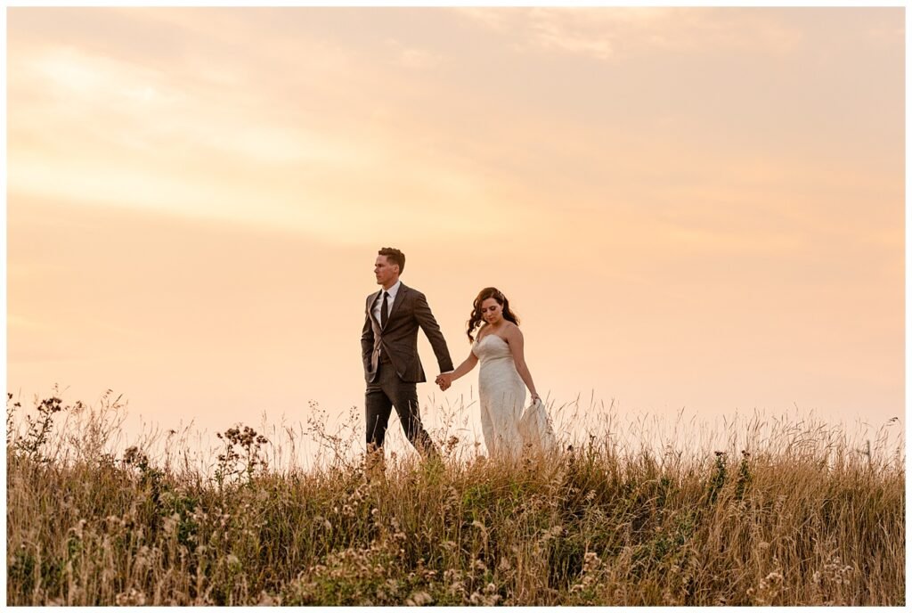 Regina Wedding Photographer - Tim & Jennelle At Home Wedding - Sunset Photo of bride and groom walking