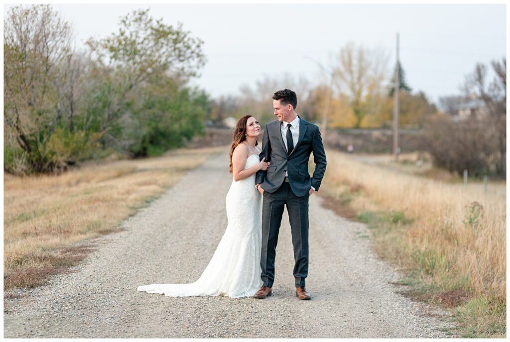 Regina Wedding Photographer - Tim & Jennelle At Home Wedding - Sunset Portraits on a grid road